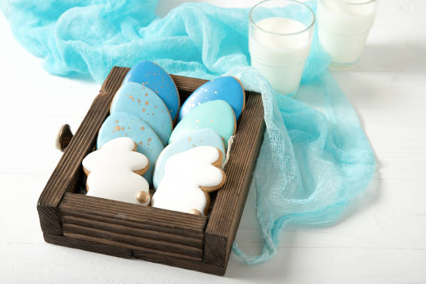 istock Easter cookies in a drawer. Glass of milk. Easter eggs. Easter bunnies. 1207827001