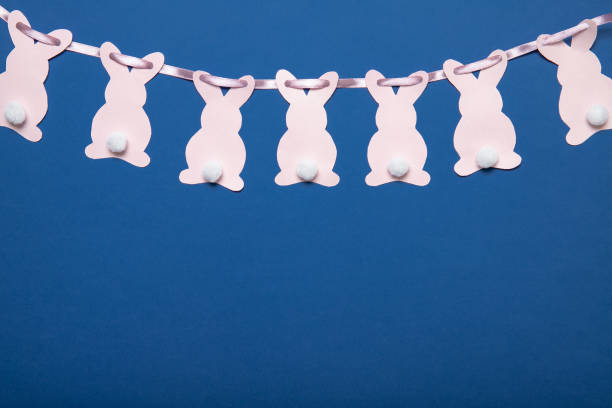 easter bunny. decoration on a blue background. easter garland. - easter remote blue cute imagens e fotografias de stock