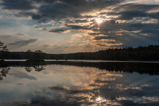 istock Sunrise over the lake with the reflection in the water, long shutter speed 1207831253