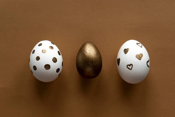istock black background, golden, easter; holiday; egg; celebration; background; traditional; food; symbol; decoration; spring; white; tradition; table; festive; color; decor; event; season; eggs; design; happy; card; paint; decorated; beautiful; group; concept; 1207832011