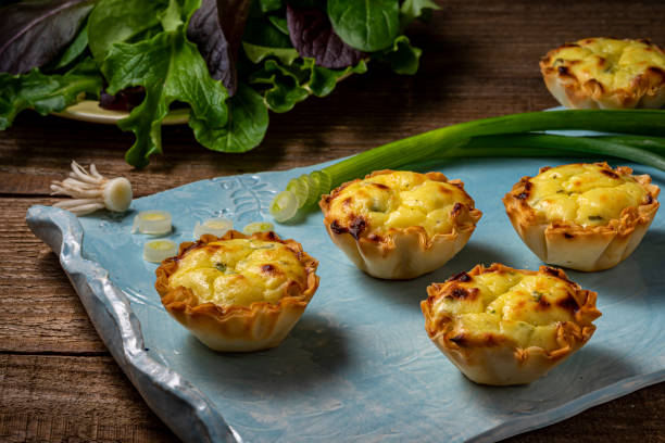 istock Filo pastry cups filled with cheese mixture on a serving tray. 1207832460