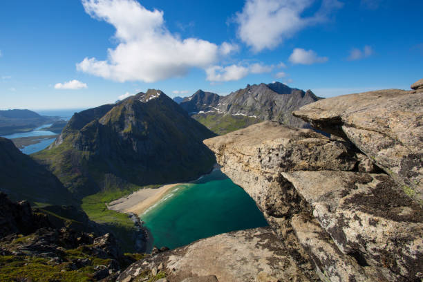 istock Rock spur at ryten peak with a beautiful view on kvalvika beach 1207833411