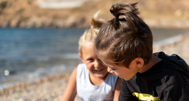 istock best friends playing at the beach 1207836913