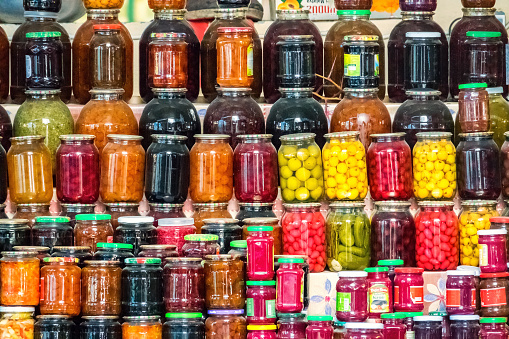 Compotes and pickled vegetables are displayed at Taza Bazaar, the largest market in Baku Azerbaijan.