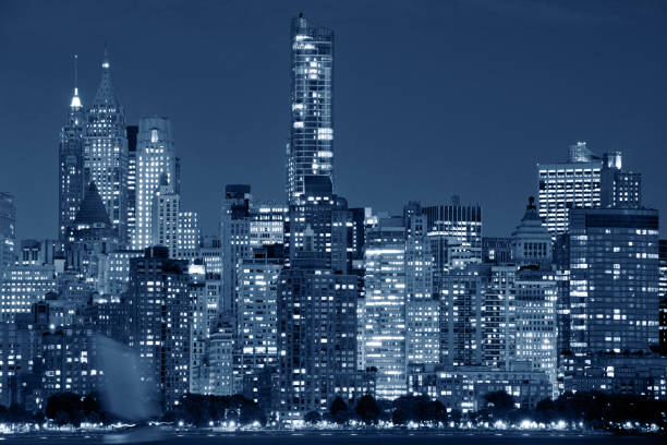 Manhattan Skyline over Hudson river, at dusk, New York City, Black and white blue toned image