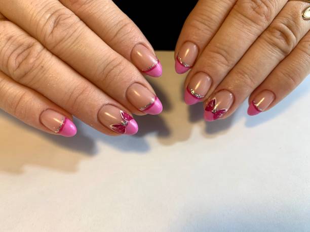 istock beautiful female bright manicure with a pattern 1207839224