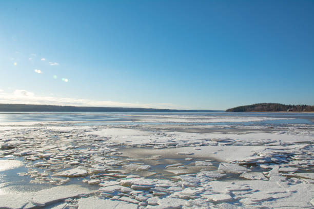 istock White broken ice on a frozen lake 1207841641