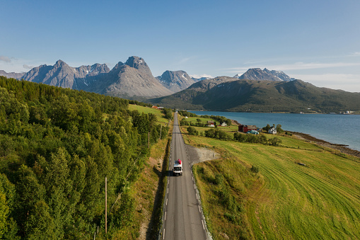 Scenic aerial view of camper van on  road in Norwegian countryside