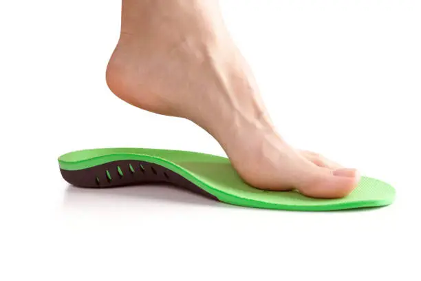 Photo of orthopedic insole with female leg