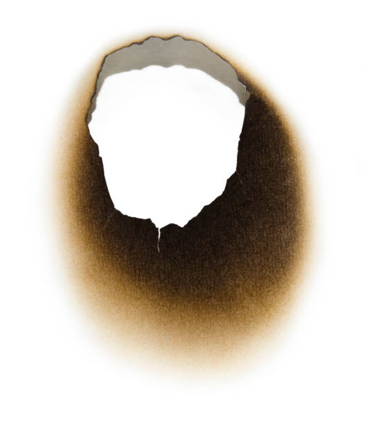 istock Burnt hole in a piece of paper 120784636