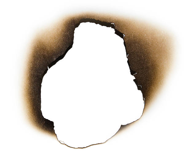 istock Burnt hole in a piece of paper 120784714