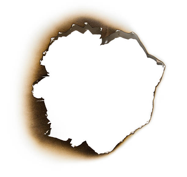 istock Burnt hole in a piece of paper 120784775