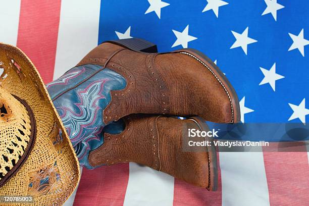 Cowboy Boot And Straw Hat Stock Photo - Download Image Now - American Culture, American Flag, Blue