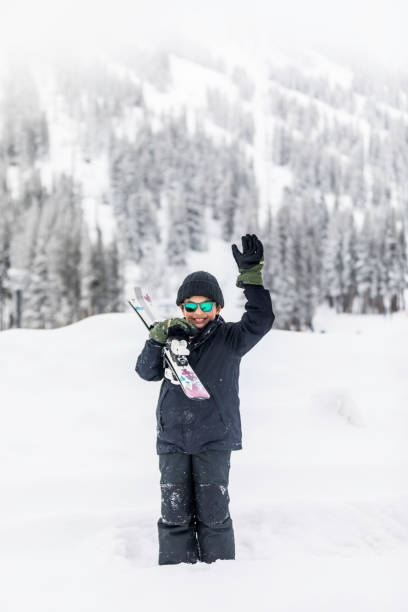 istock Kids playing and Having fun in the Snow 1207854200