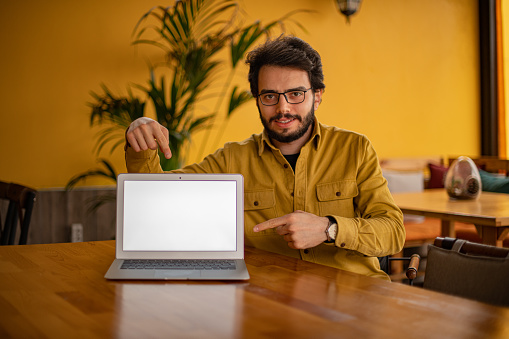 Young Student Man Showing Laptop Screen
