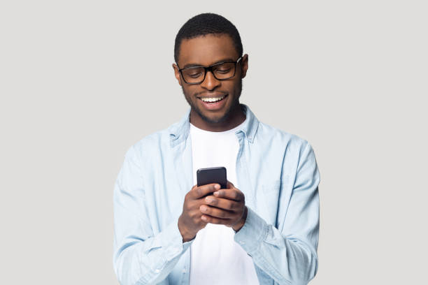 istock Joyful smiling african american young man playing online game. 1207856388