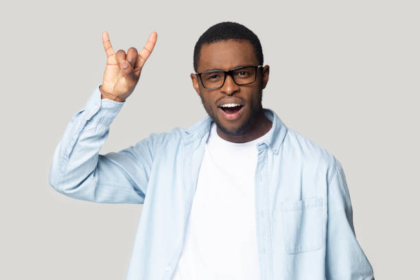 istock Funny crazy african american young man showing horns gesture. 1207856399