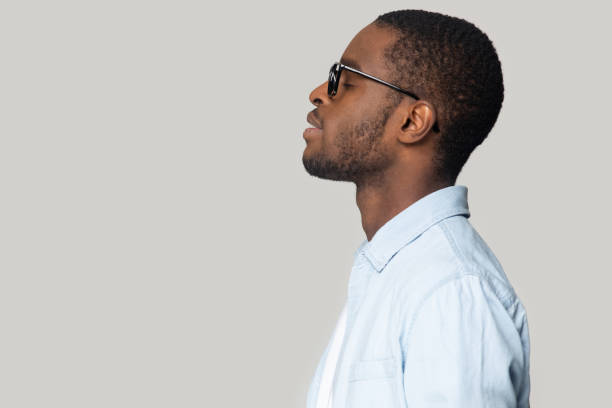 istock Young happy african american man relaxing with closed eyes. 1207856409