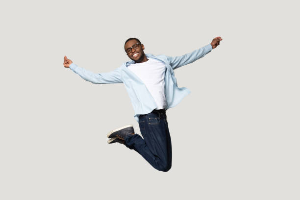 istock Full length overjoyed millennial african american man jumping. 1207856428