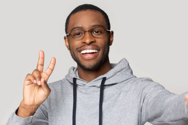 istock Webcam view happy african american guy in sportswear taking selfie. 1207856433
