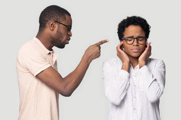 istock Aggressive millennial african american man shouting at wife. 1207856447
