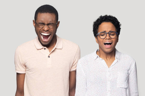 istock Stressed mad millennial ethnic family couple feeling angry, screaming. 1207856464
