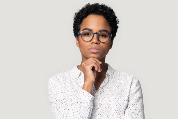 istock Thoughtful young african american female professional head shot portrait. 1207856483