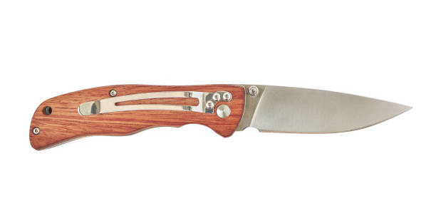 istock Every day carry folding knife with blade out and wooden handle, isolated on white background. 1207856840
