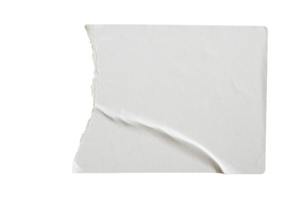 istock Torn paper sticker label isolated on white background 1207857012