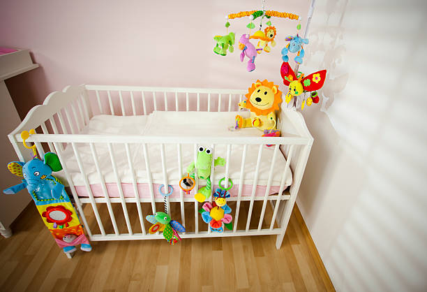 istock Cot for baby with colorful toys 120785829