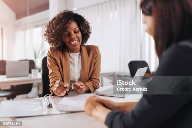 Client Consulting With A Agent Stock Photo - Download Image Now - Advice, Financial Advisor, Insurance Agent