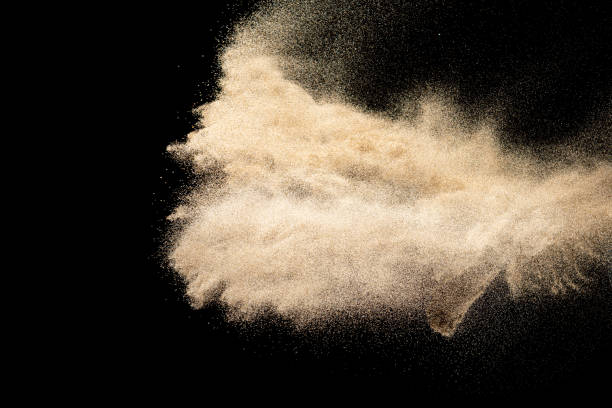 istock Brown colored sand splash.Dry river sand explosion isolated on black background. Abstract sand cloud. 1207872181
