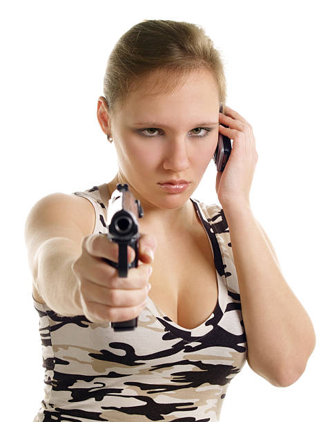 young woman 、ピストル、携帯電話 - gun women semi automatic pistol young women ストックフォト��と画像
