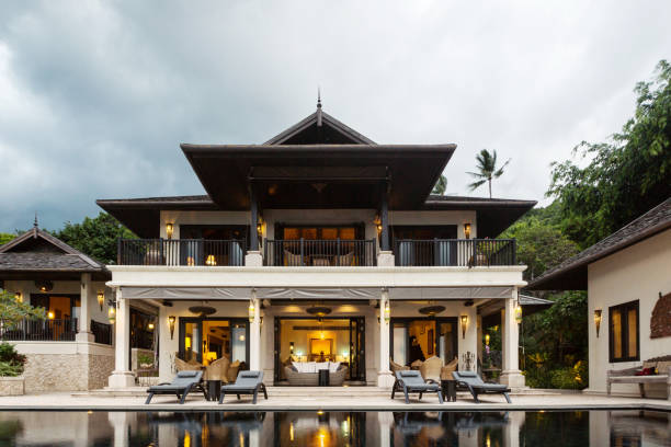 istock Swimming pool with sea view in luxury villa interior 1207879507