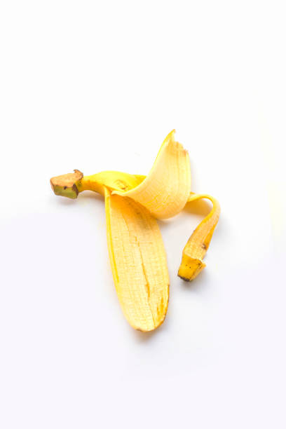istock Yellow banana peel with isolated on white background 1207879760