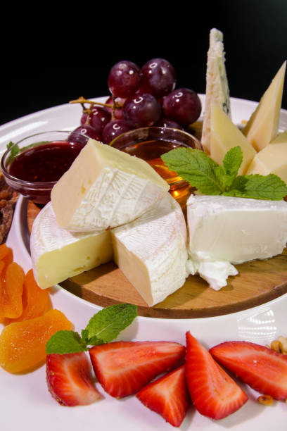 istock Cheese plate.Camembert cheese, Parmesan, blue cheese. 1207883241