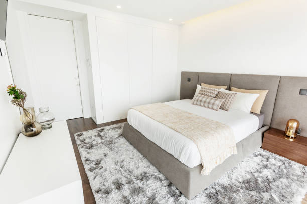 istock Simple bedroom interior design, grey and white colours, big window 1207883307