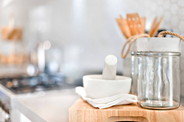 istock Mortar and pestle with a glass bottle in the kitchen 1207884201