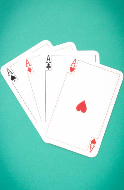 istock Four aces on green background. Gambling risk concept 1207885039
