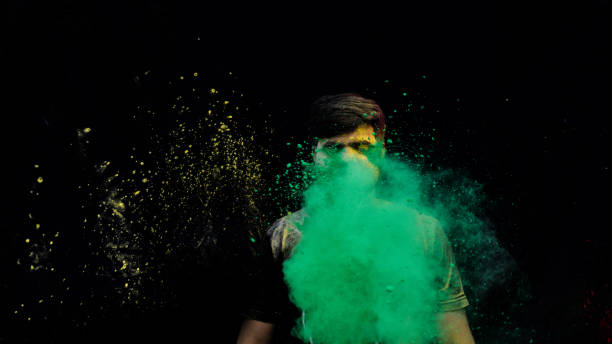 istock man with holi colors 1207888590