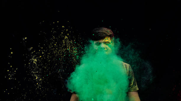 istock man with holi colors 1207888595