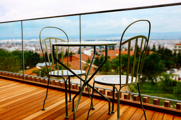 istock Empty table chair in front of the landscape, metal design. 1207889331