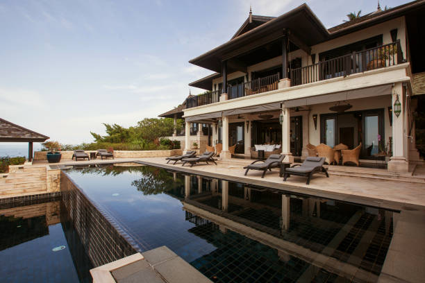 istock Luxury tropical villa with big swimming pool interior outside 1207889352