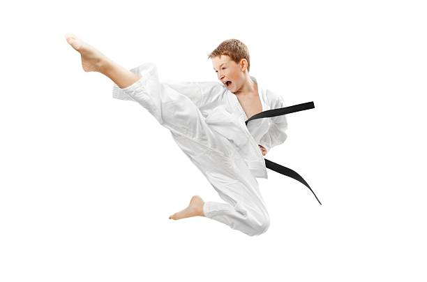 artes marciales niño - karate kicking tae kwon do martial fotografías e imágenes de stock