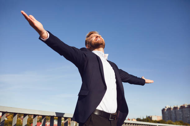 istock Successful happy businessman on sky background 1207892762
