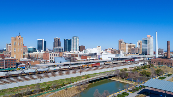 The downtown Birmingham, Alabama skyline and cityscape from Railroad Park in February 2020.