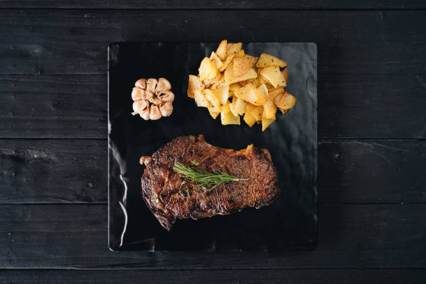 istock Rare filet mignon beefsteak with roasted potatoes 1207893901