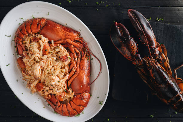 istock Pasta with Lobster meat on the black background 1207893962