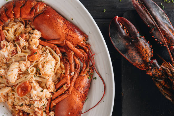 Pasta with Lobster meat on the black background