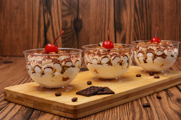 istock Cakes with berries on the board. Wood background 1207894377